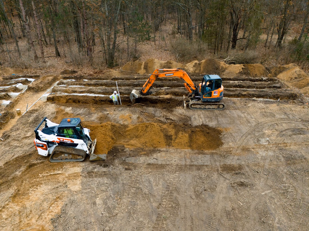 Kalamazoo Excavation crews dig a drainbed for a large commercial septic system.