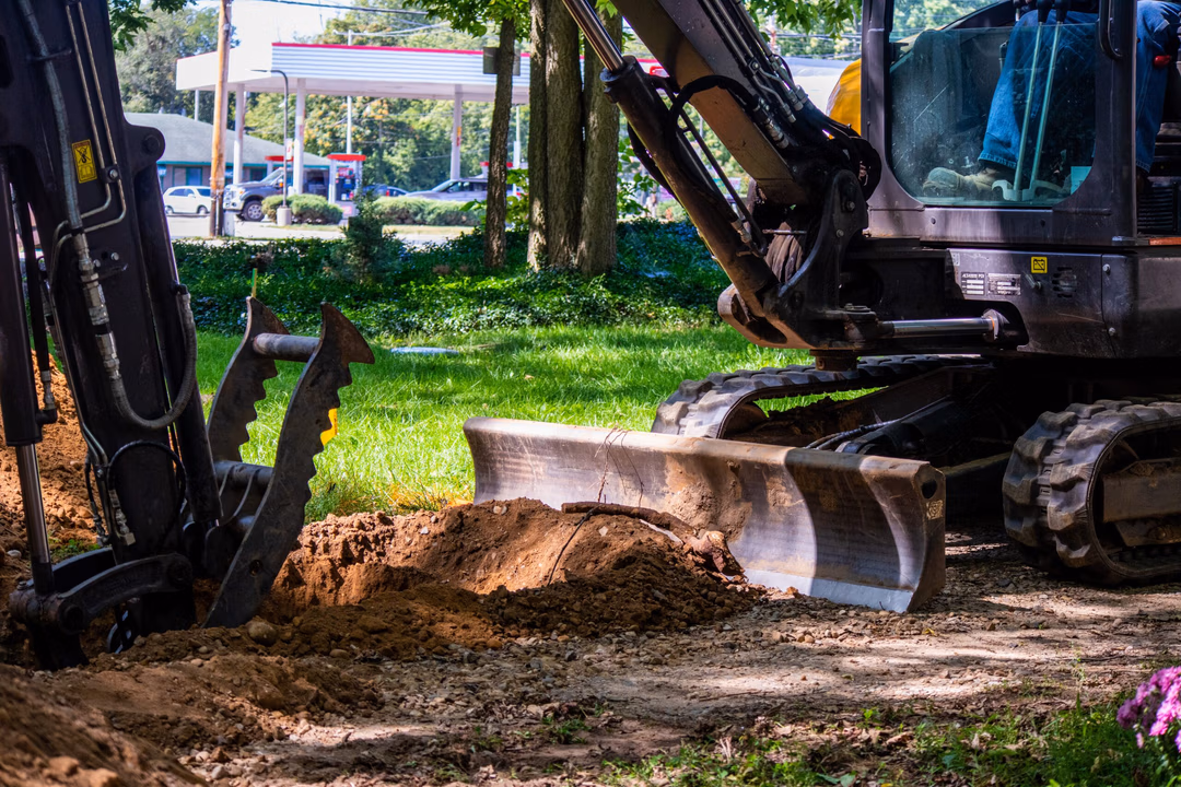 Kalamazoo Excavation crews using heavy machinery to excavate a residential property..